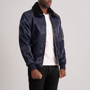 
Blue Satin Bomber Jacket - Vista posteriore con spalle definite e orlo pulito