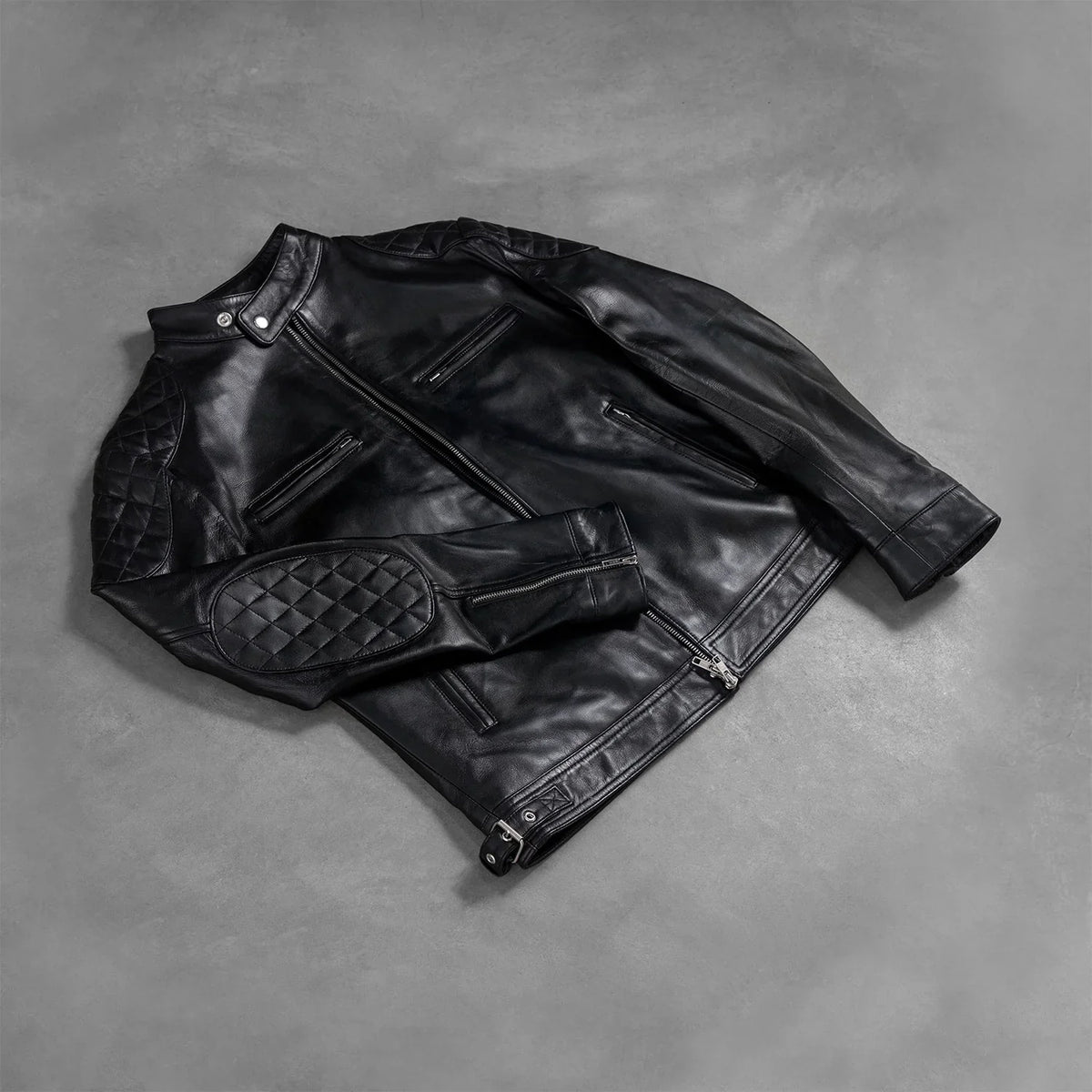 Zipper & Hem Craftsmanship Construction Detail on Men's Gatsby Quilted Black Leather Biker Jacket