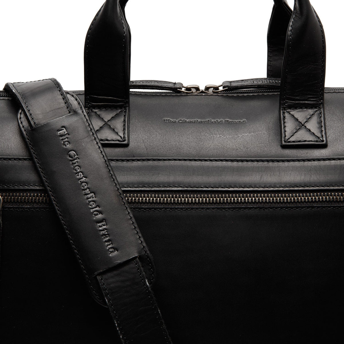 
Solid Antique Brass Hardware & Heavy-Duty Dual Zipper Detail on Levanto Borsa porta PC in pelle pieno fiore