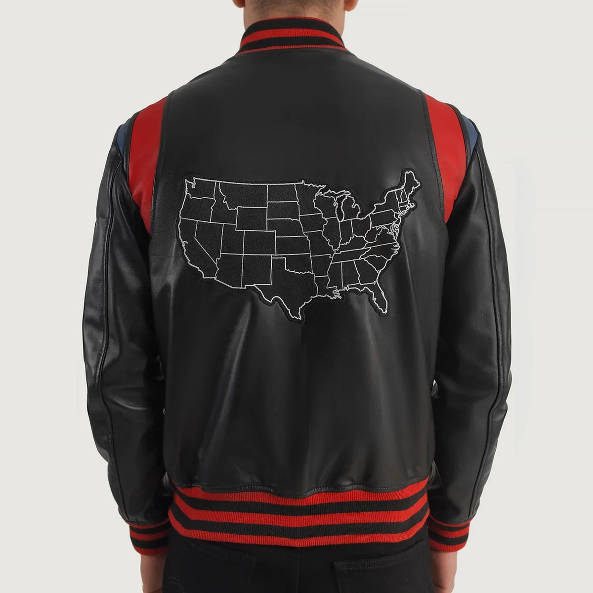 Liberte USA Black Leather Varsity Jacket - Vista laterale con taglio manica ergonomico