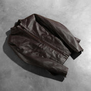 
Dettaglio artigianale dell'orlo su Rumella Maroon Leather Biker Jacket